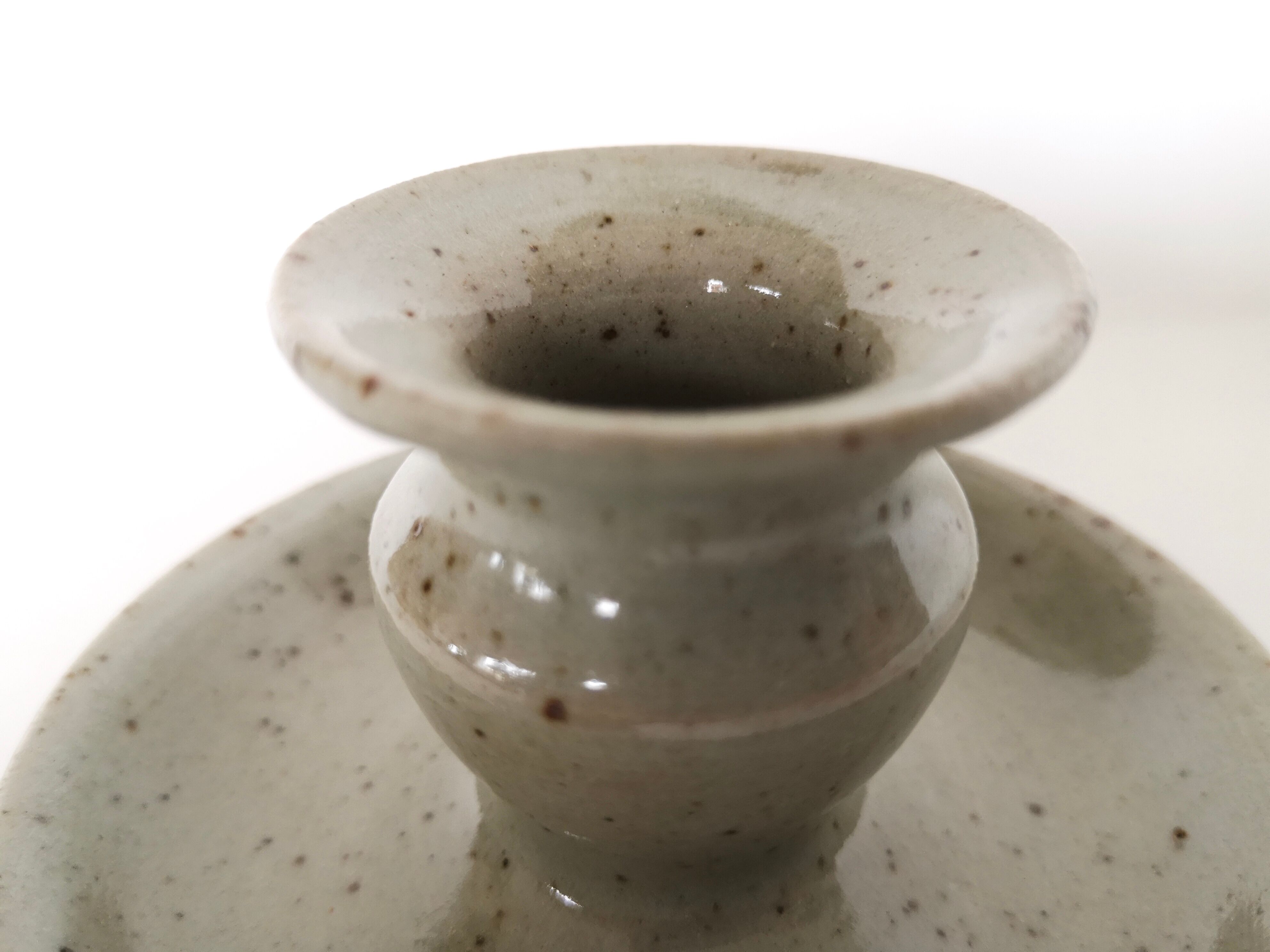 Enamelled sandstone candlestick