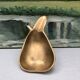 Vintage brass ashtray in the shape of a fruit, pear