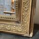 Miroir de cheminée - bois vernis et stuc doré à décor de palmettes