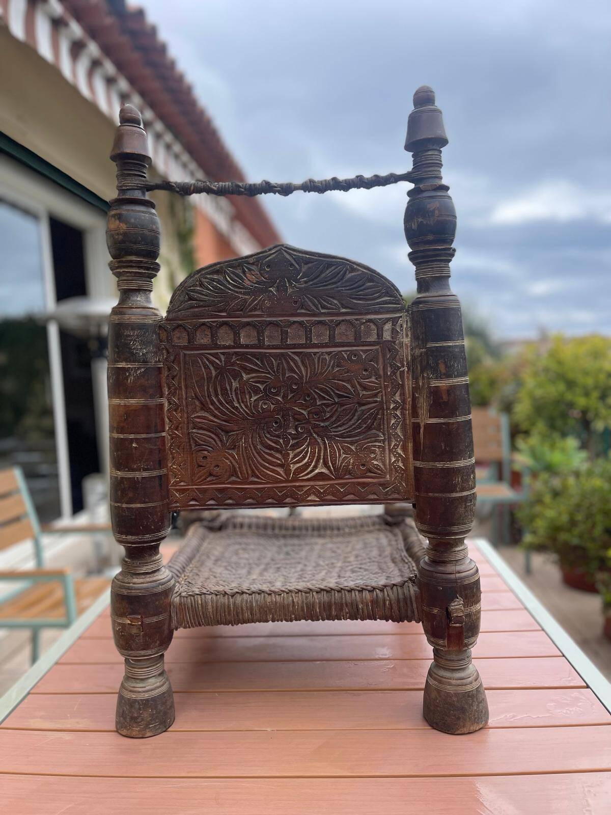 Pair of antique traditional Indian carved wooden chairs