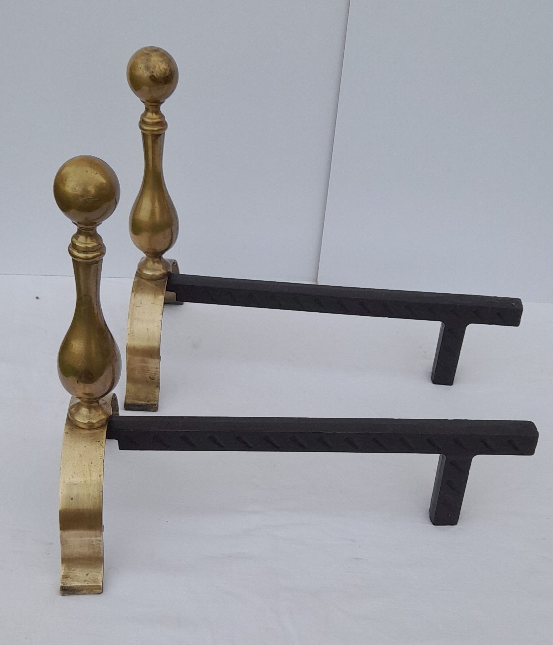 Pair of brass and black wrought iron chenets