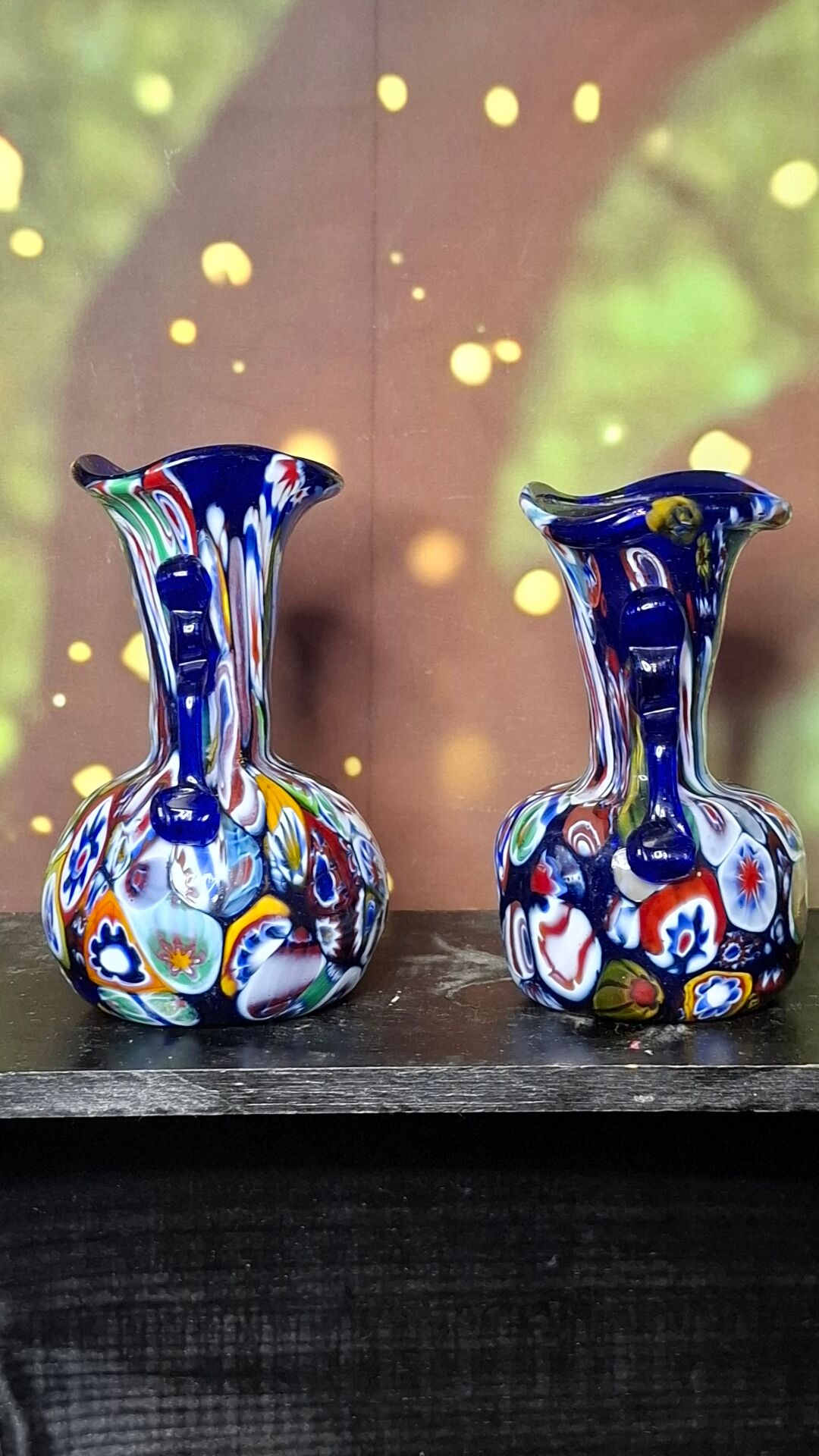 Pair of antique millefiori glass vases attributed to Murano with 2 handles.