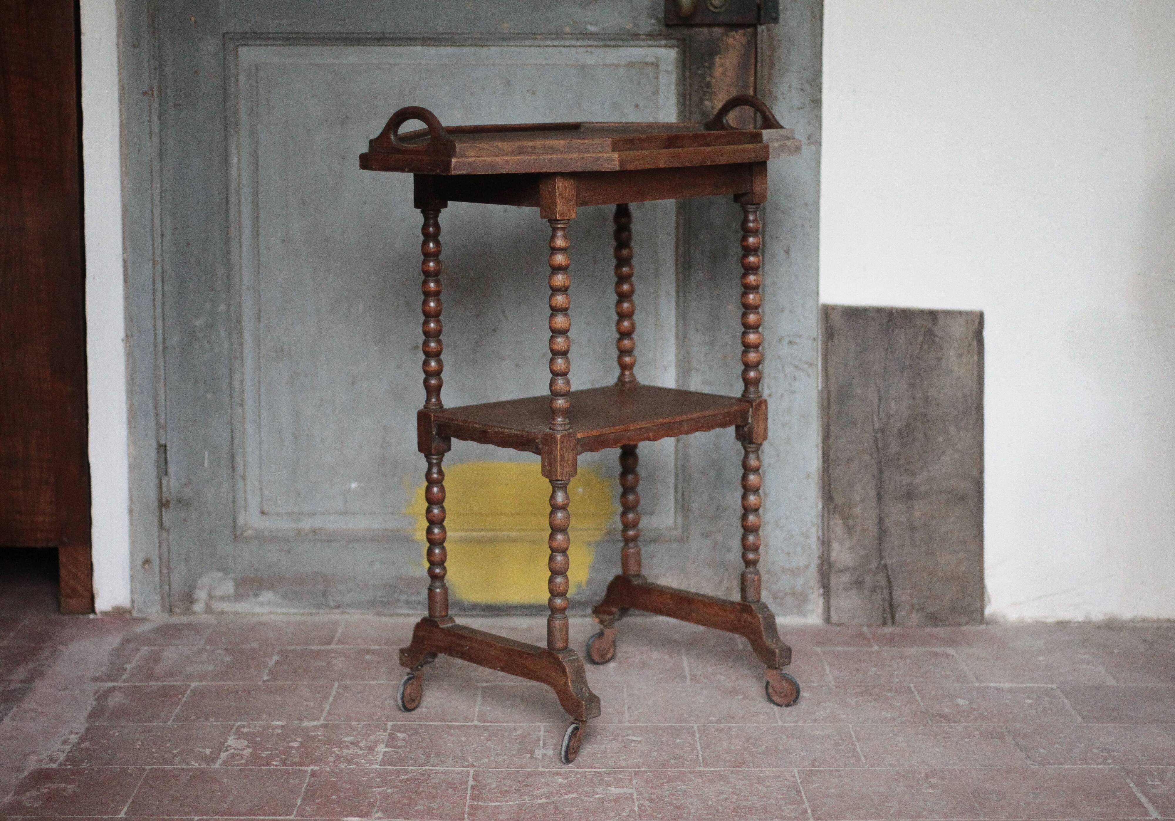 Vintage turned wood dessert trolley, wheeled table with removable top.