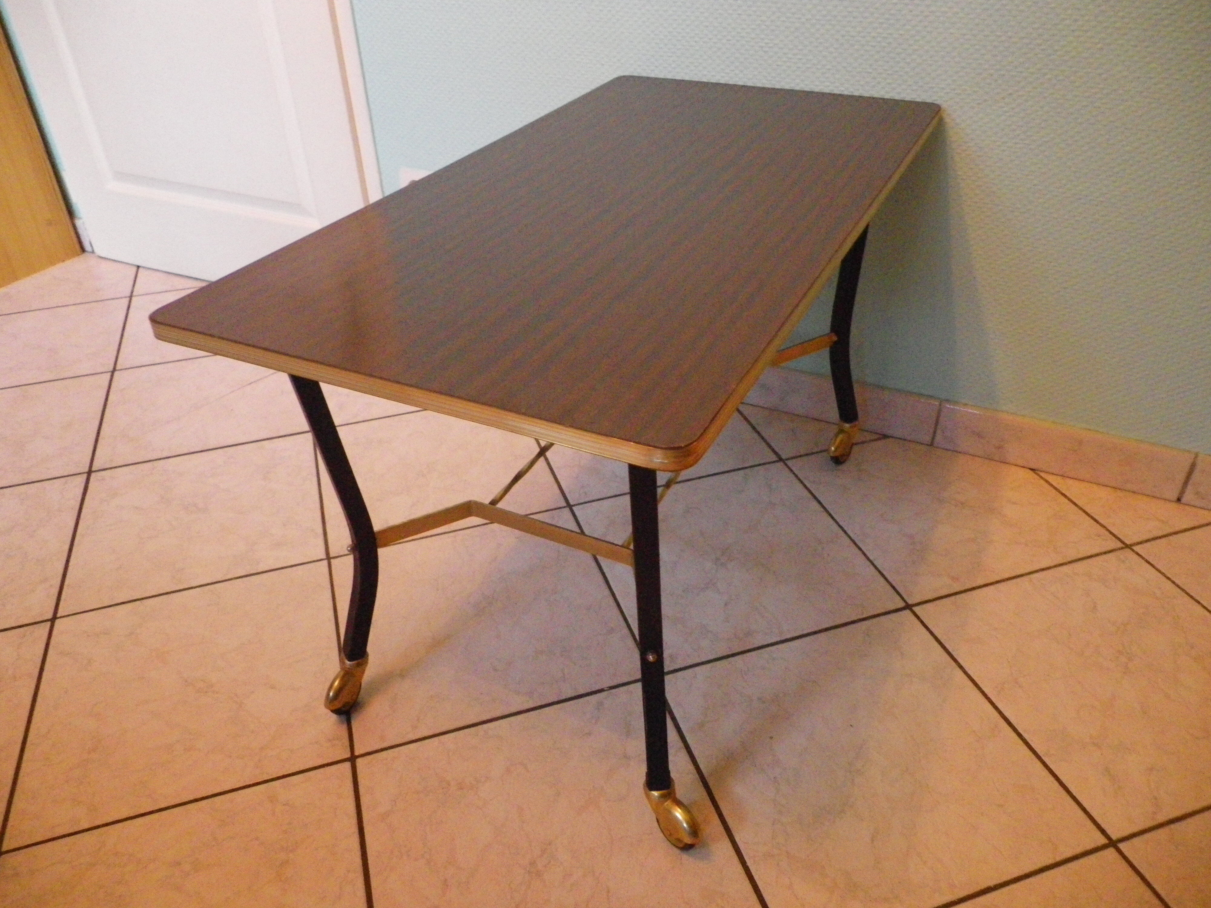Lounge table, side table on wheels, formica top, gold and black metal