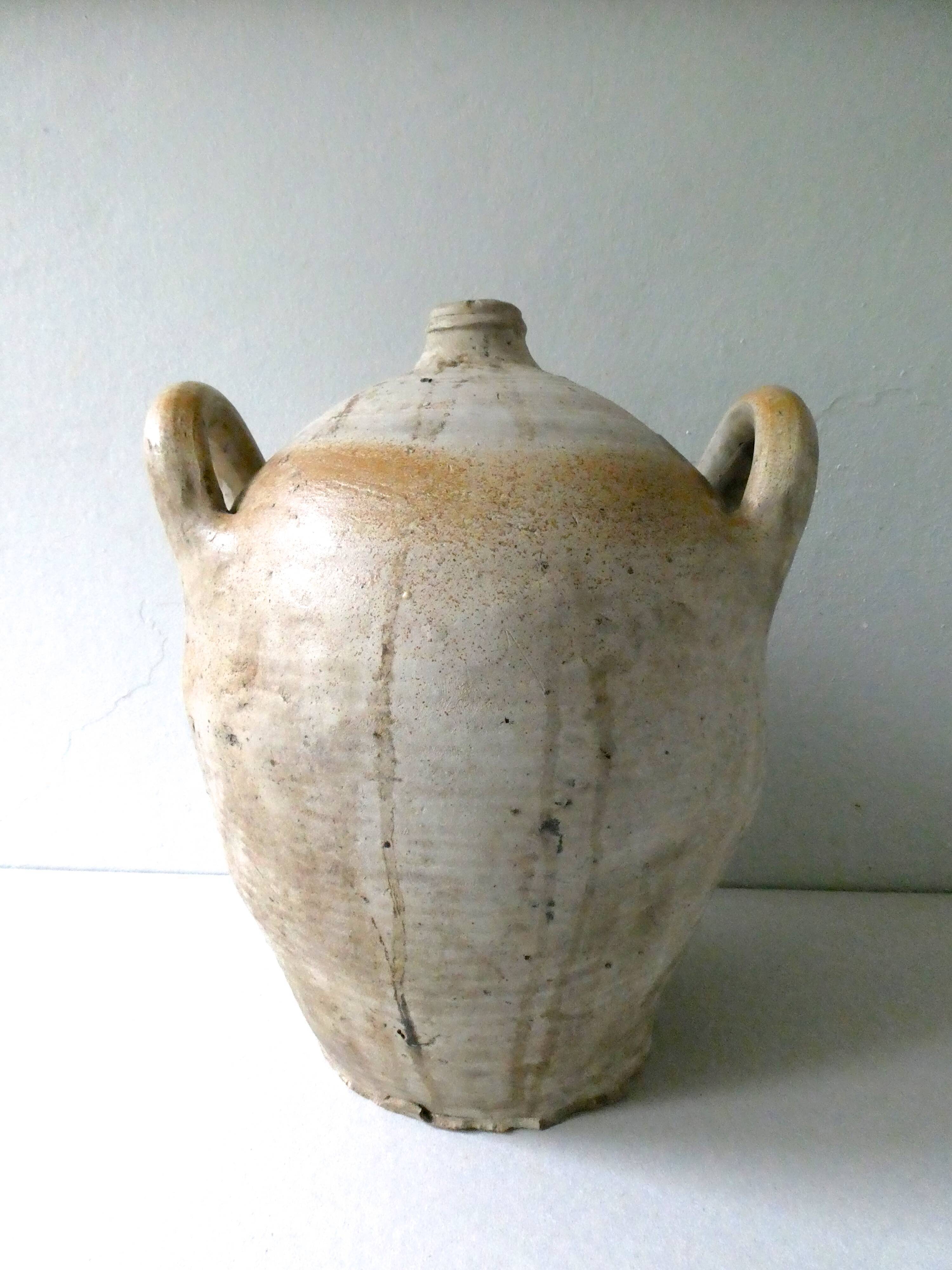 Old glazed stoneware bonbonne