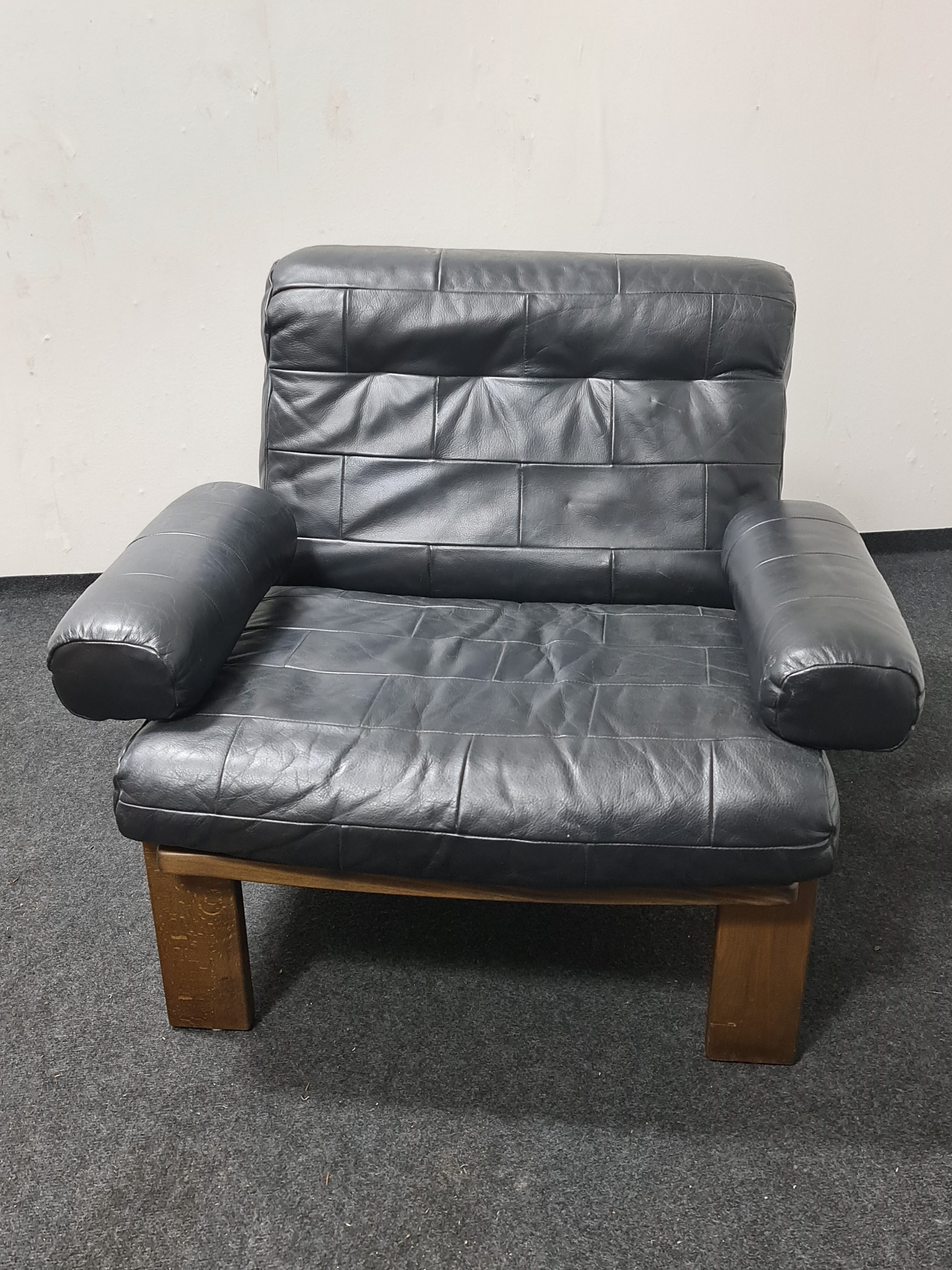 Vintage black leather patchwork and oak lounge chair