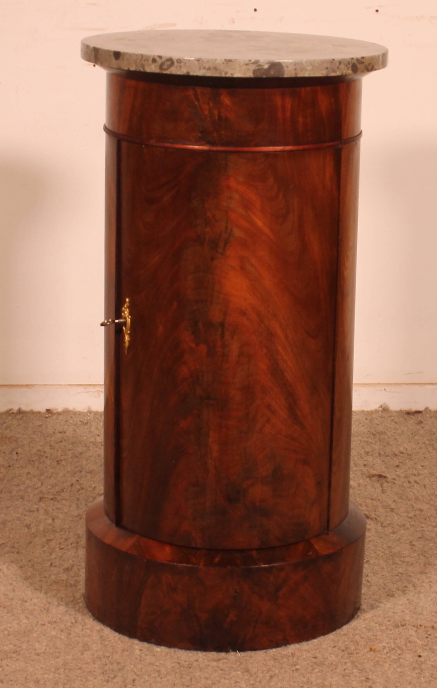 large Empire period flamed mahogany headboard.