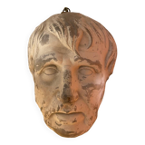 Plaster face wall statue