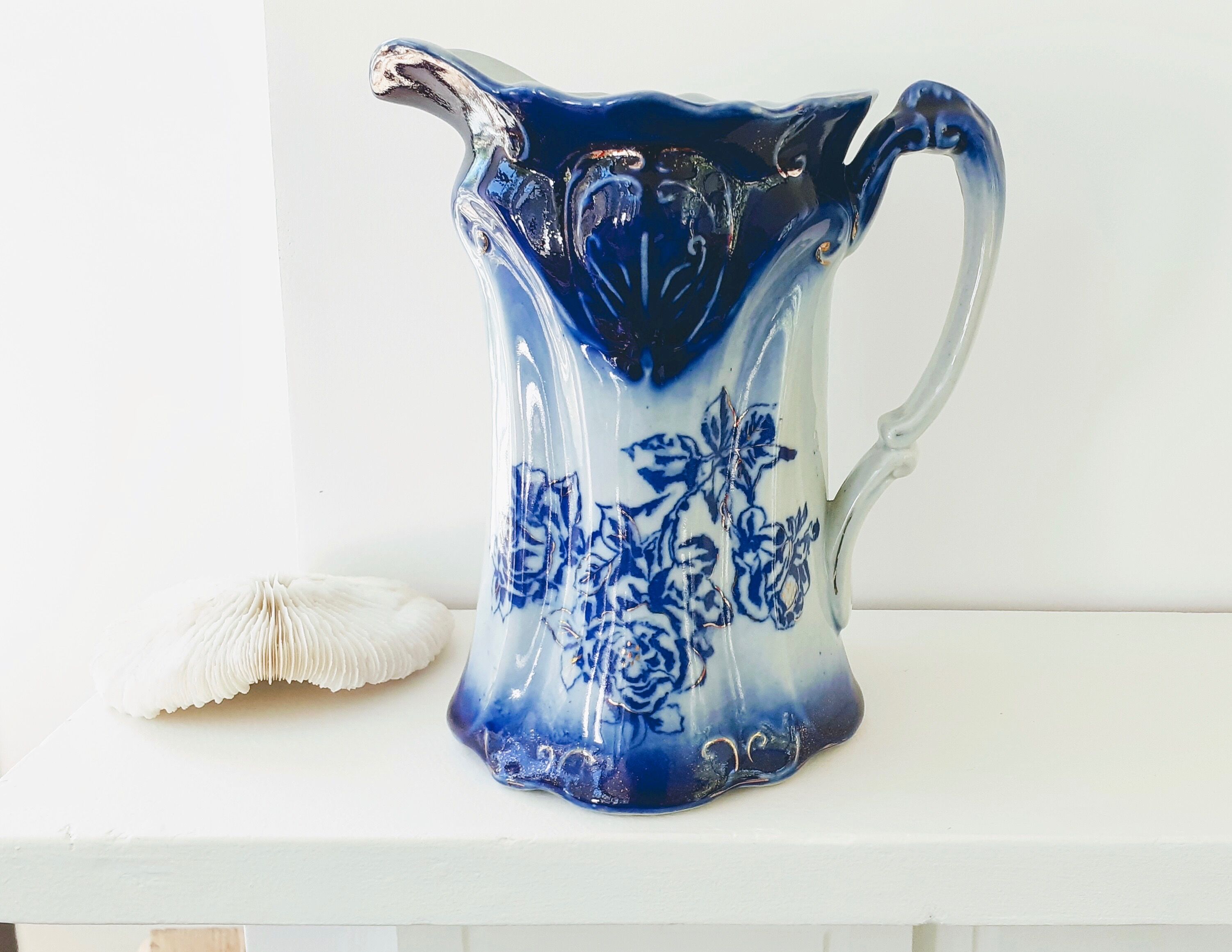 Old pitcher in blue flow, T.Rathbone, England circa 1910