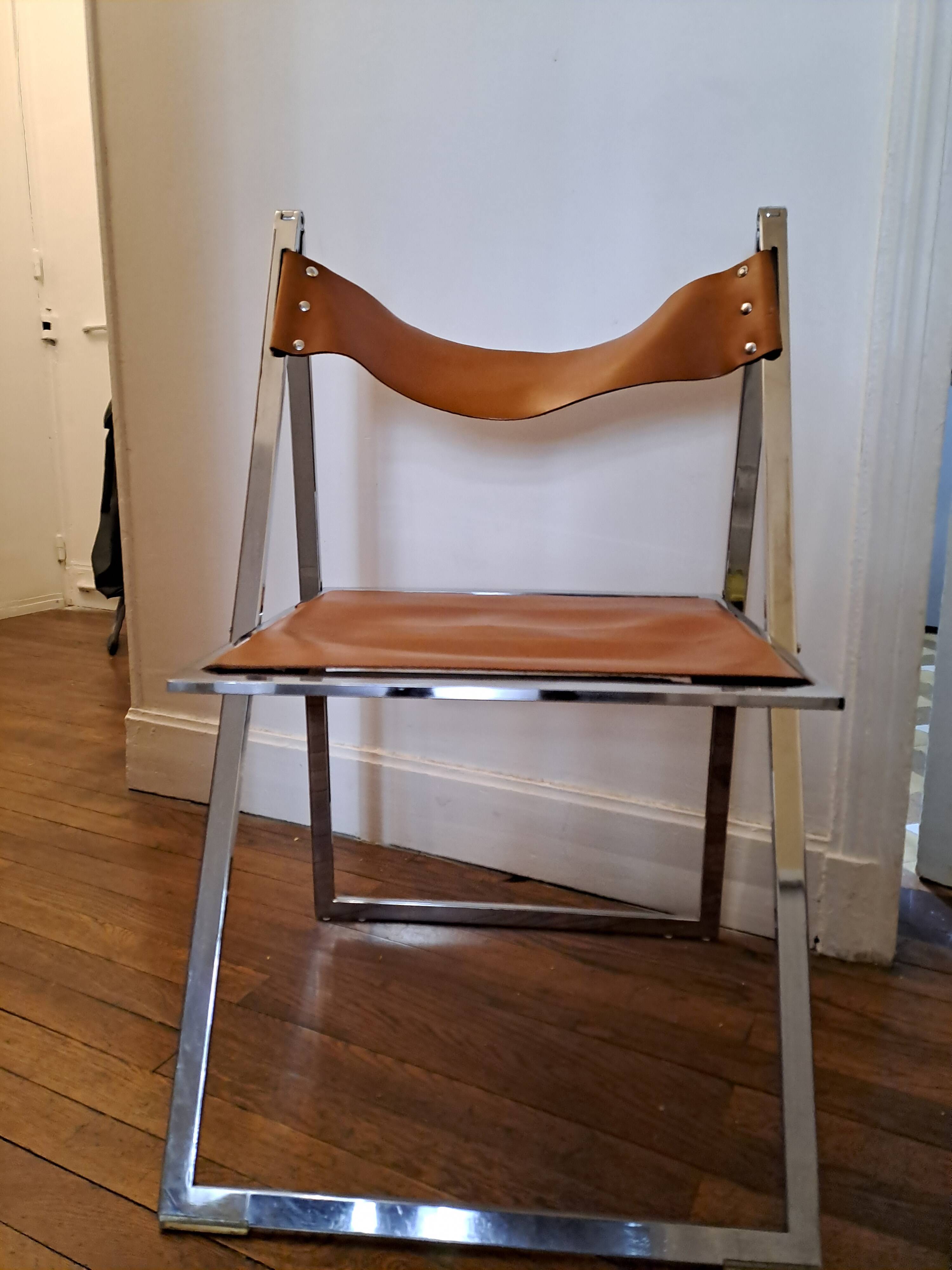 2 Chromed metal and leather folding chairs. 70s. Fontoni & Geraci