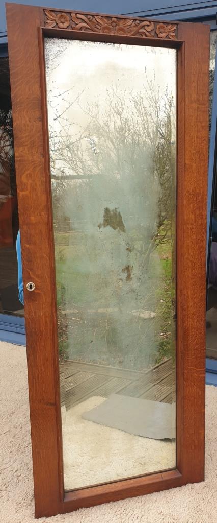 Art Deco door mirror with floral pattern frame