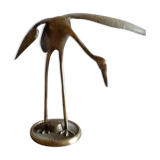 Bird takes off brass