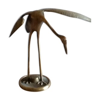 Bird takes off brass