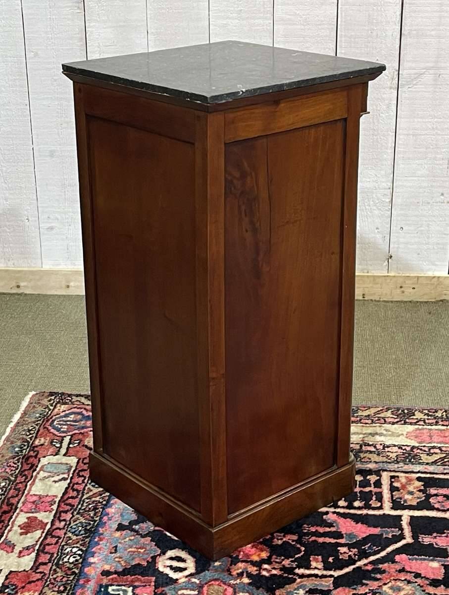Empire bedside table from the 19th century in cherry wood and black marble.