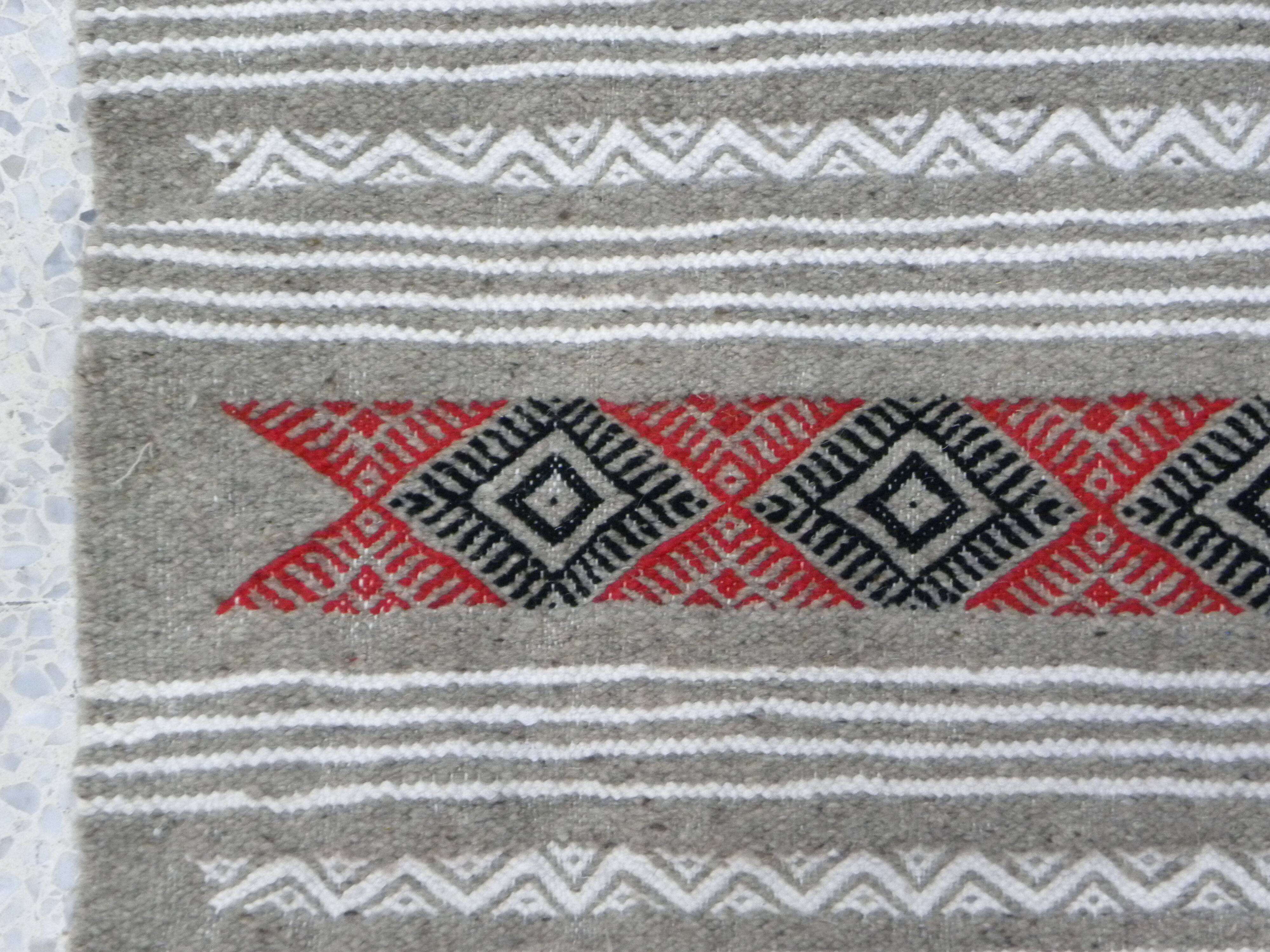Geometric woven rug with fringes – Ethnic style – Hallway & interior