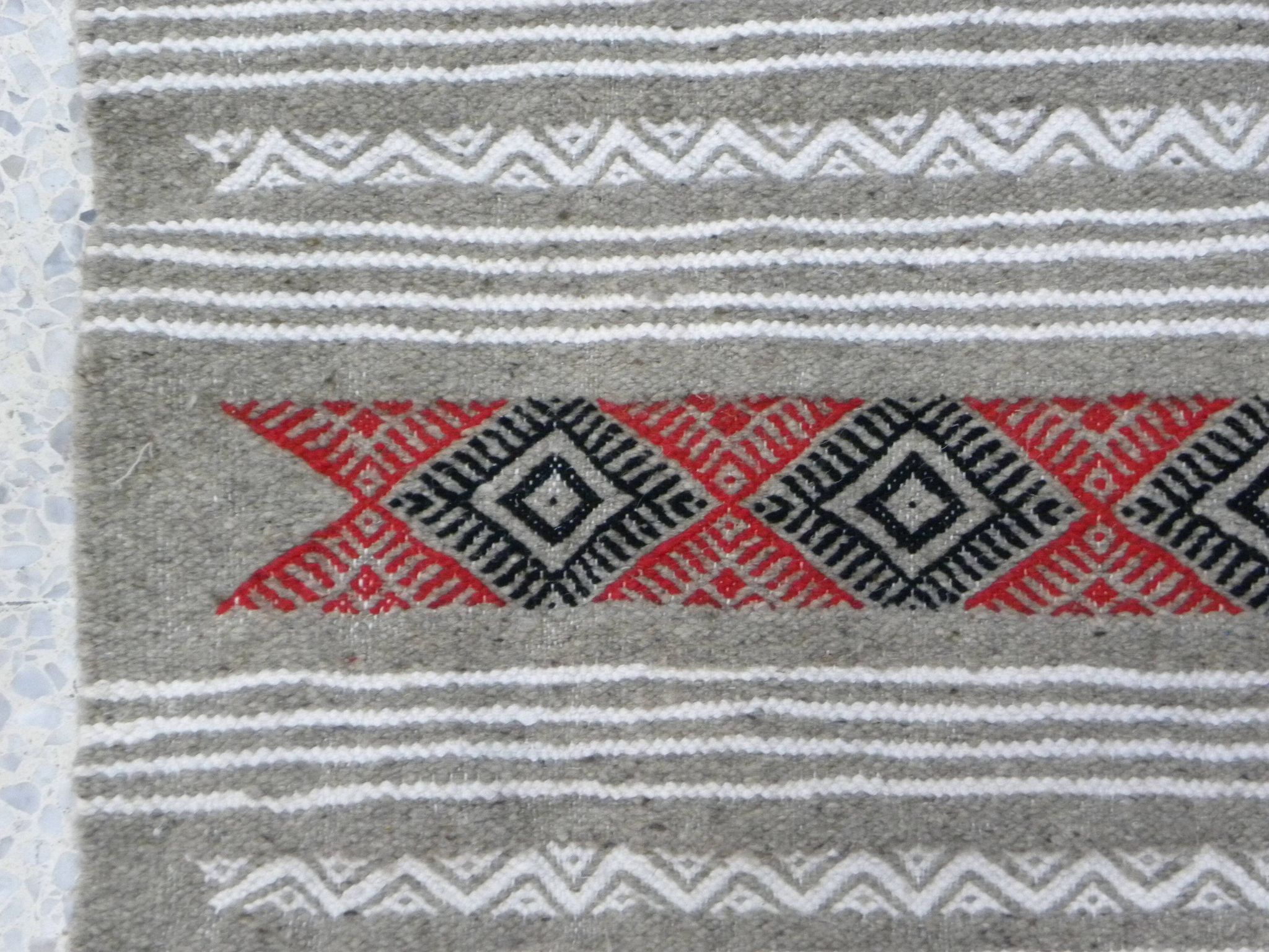 Geometric woven rug with fringes – Ethnic style – Hallway & interior