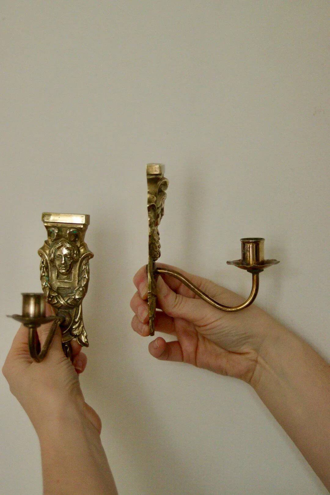 Pair of mid-century Swedish brass face motif sconces