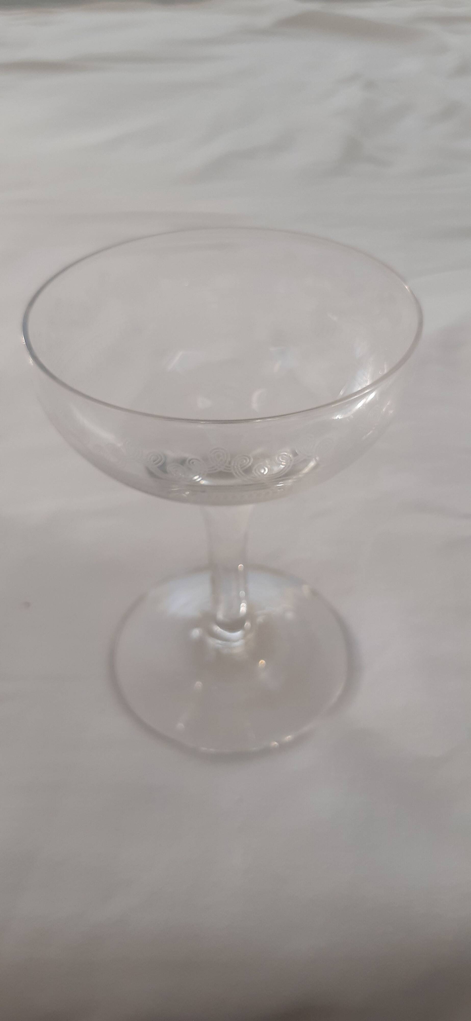 Ten champagne coupes from the Belle Époque.