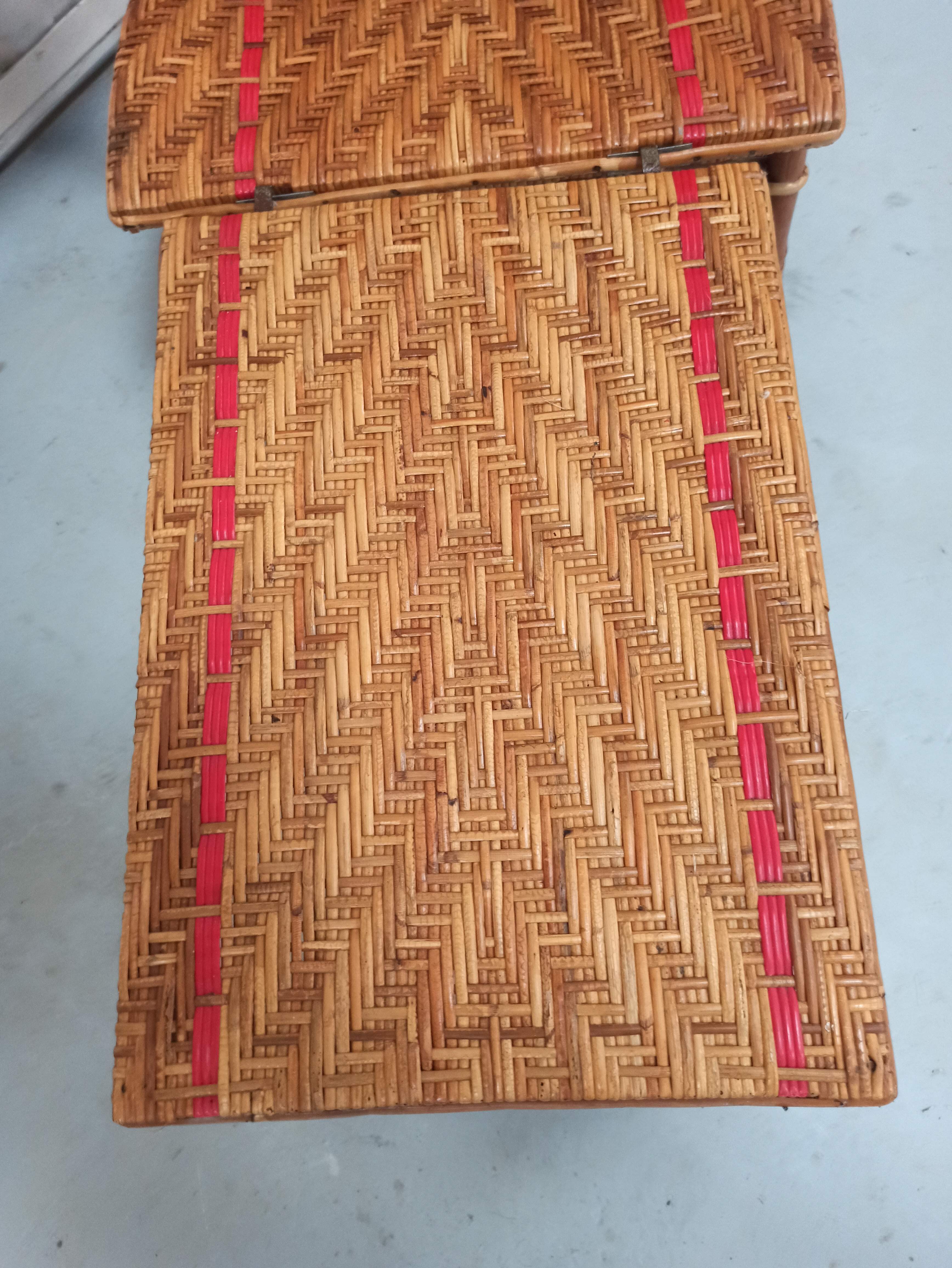 Sunbathing sunbathing in wicker rattan wood deckchair red lounger