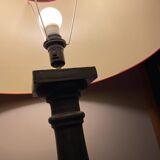 Lamp with red hat and cast iron base