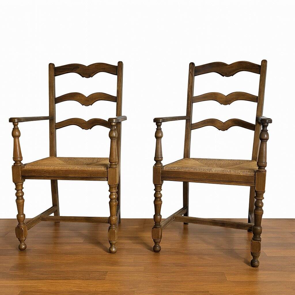 Pair of rustic antique armchairs in wood and woven straw.