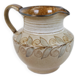 Glazed ceramic jug with plant decoration