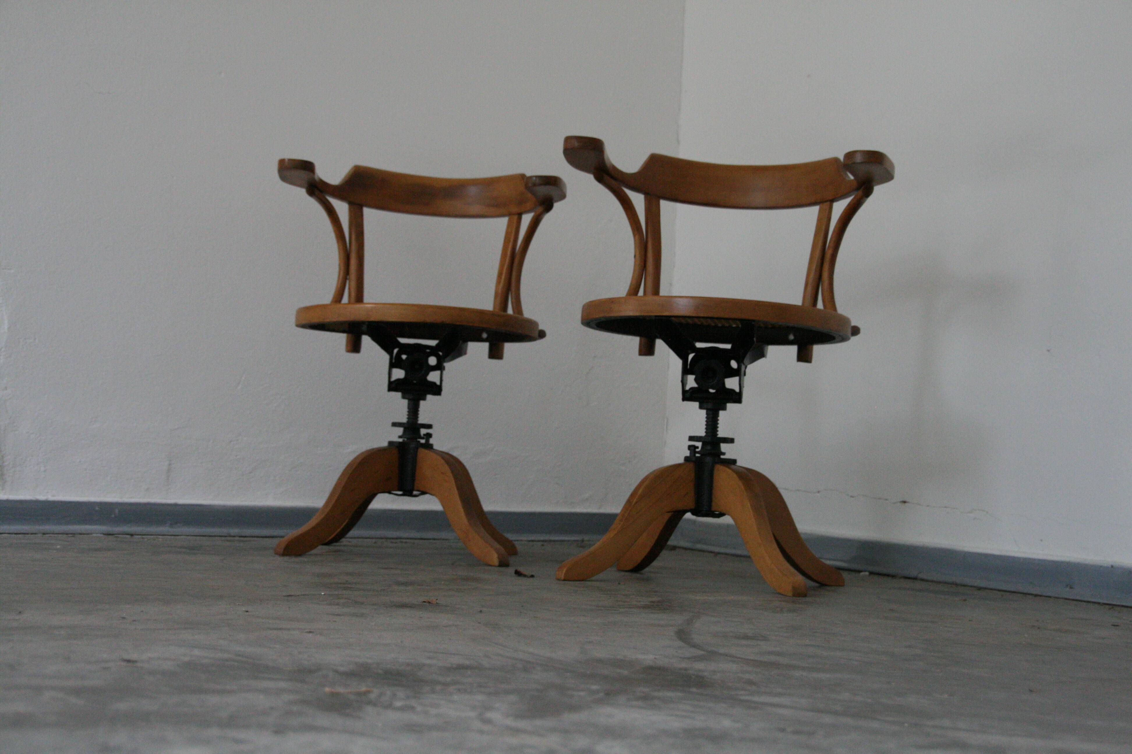 A pair of vintage bent wood svivel chairs by Salvaatore Leone Italy