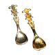 Set of 2 vintage gold metal salt spoons.
