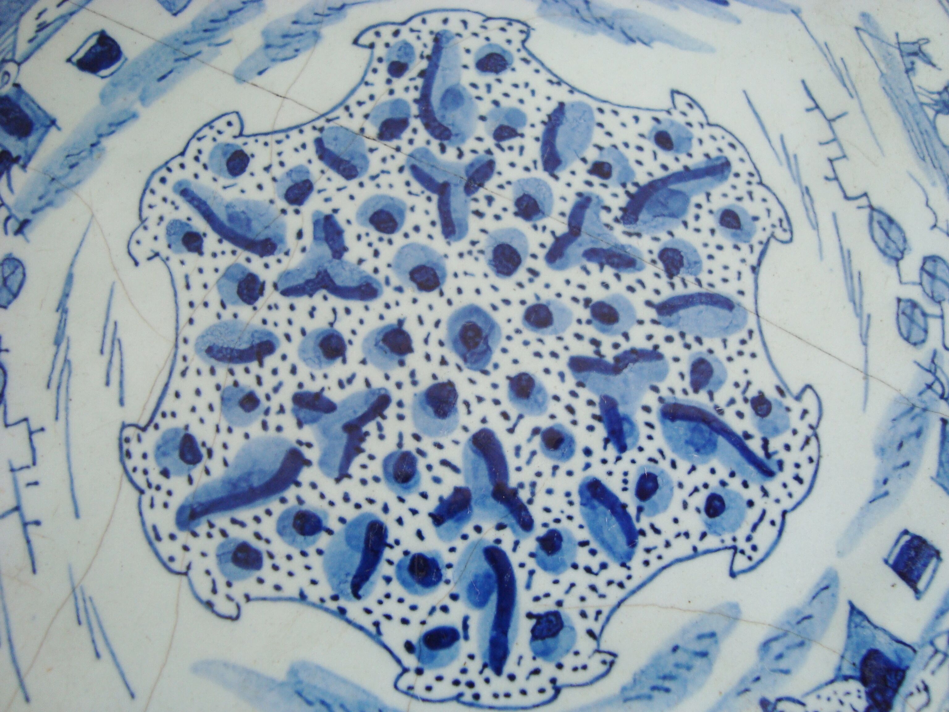 Old blue and white Delft decorative plate with Chinese motifs