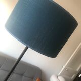 Vintage lamp holder wears magazines and wears black and brass plants