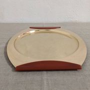 Plates and a brass and Bakelite cut by PM Italy, Italy around 1970.