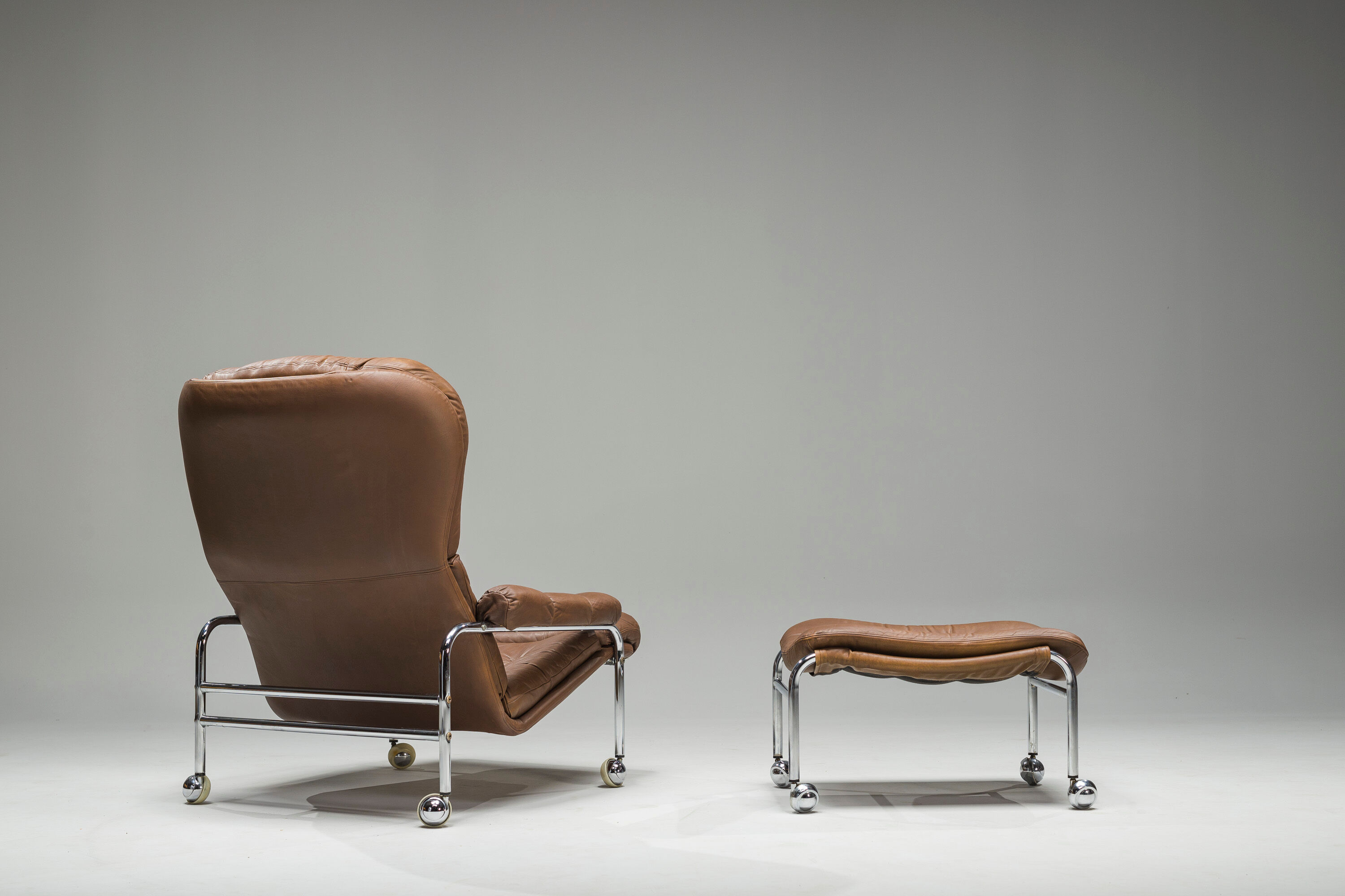 Swedish Lounge Chair and Ottoman in Chrome and Brown Leather by Scapa Rydaholm, 1960s, Set of 2