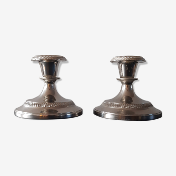 Duo of zinc candle holders