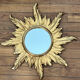 Miroir soleil en bois doré