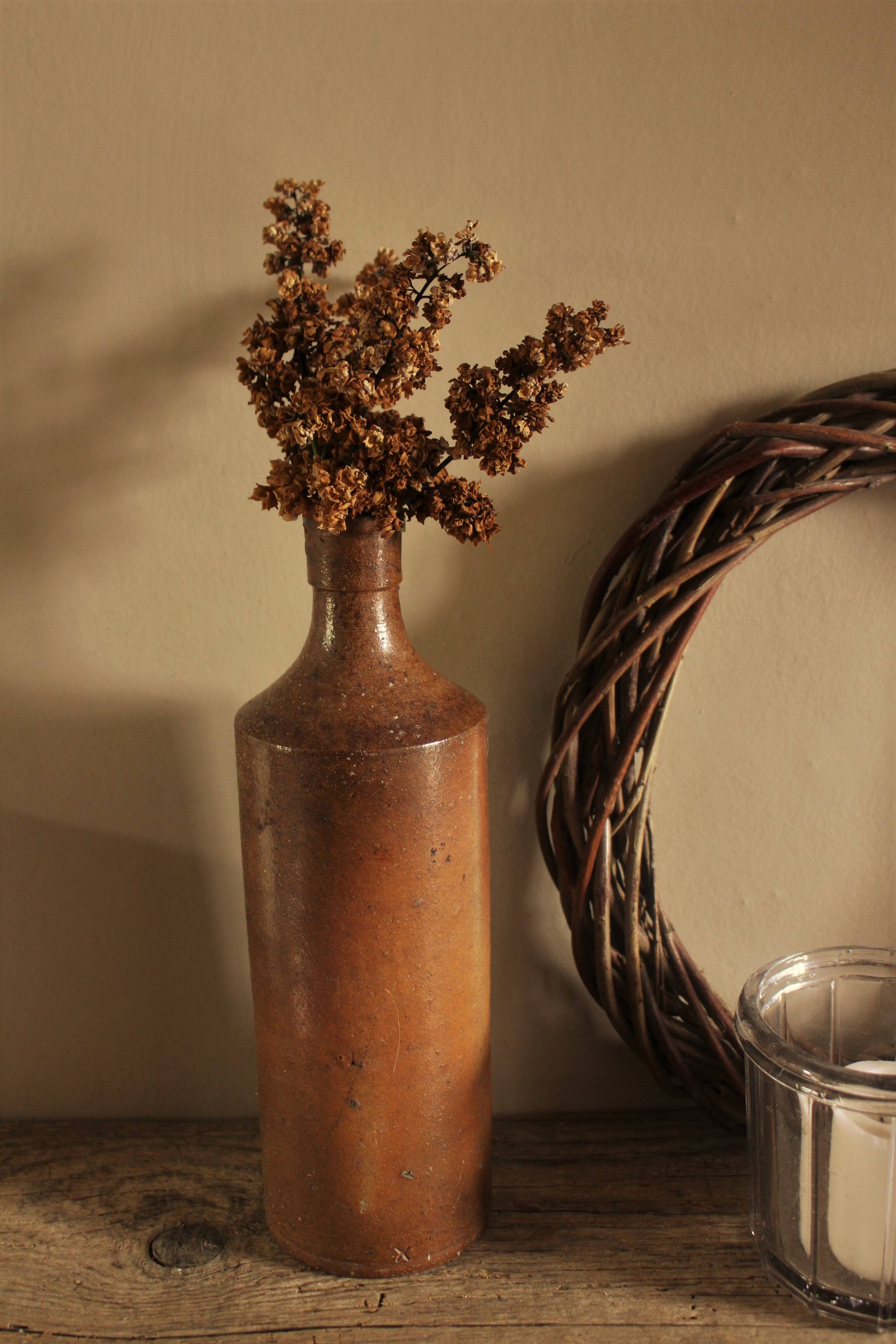 Vintage stoneware liqueur bottle with spout