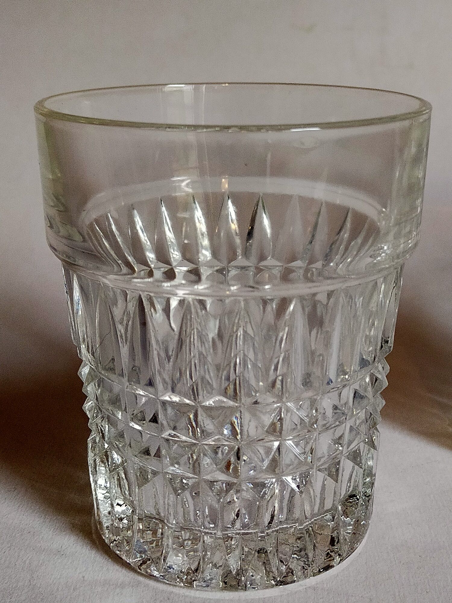 Trio of vintage whiskey glasses in pimpled glass