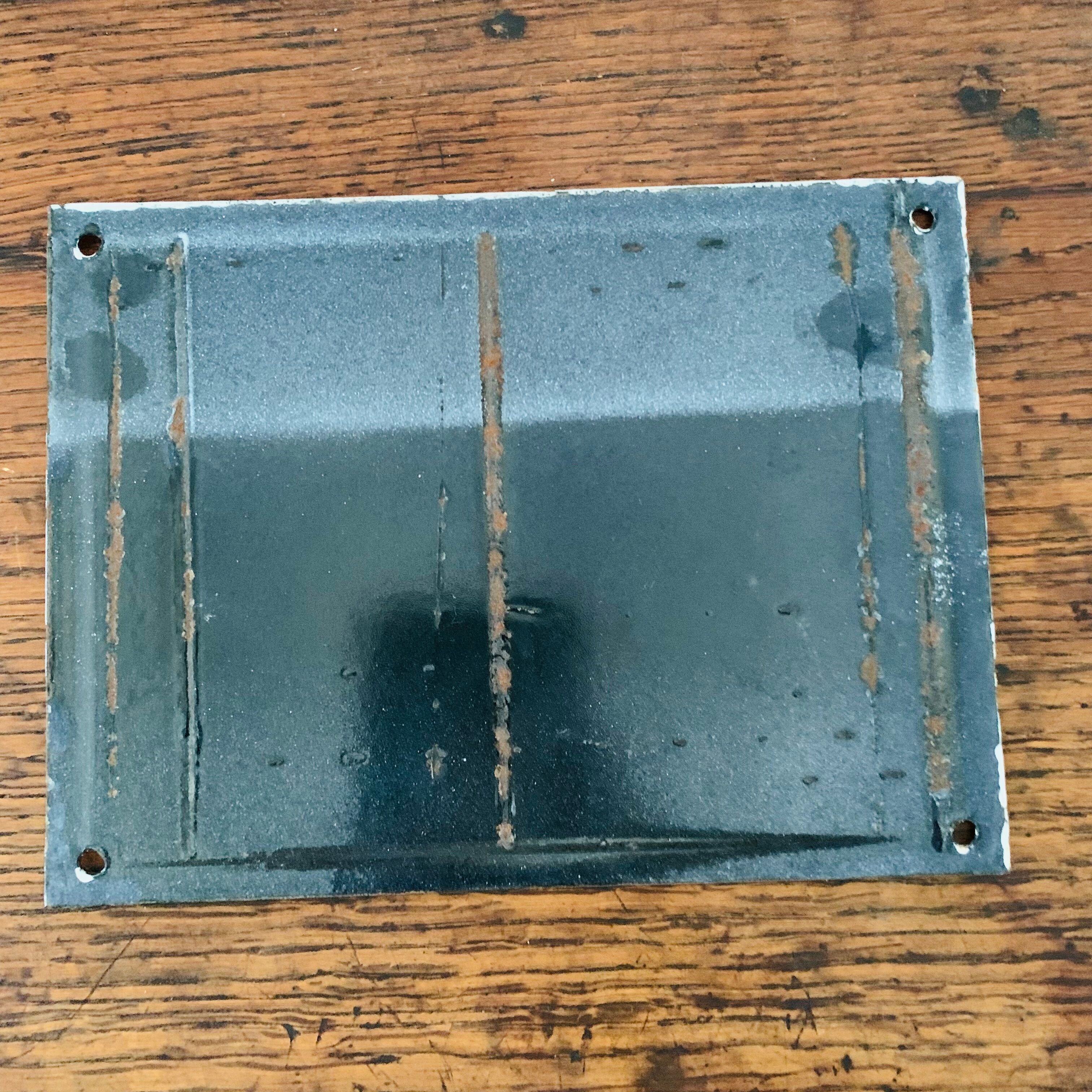 Old enamelled plaque of building