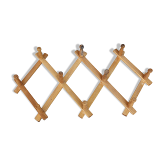 Vintage retractable wall-mounted coat rack made of pine wood