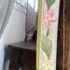 Carved wooden mirror, colourful floral decoration.