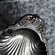 Large vintage shell-shaped platter in shiny silver-plated metal.