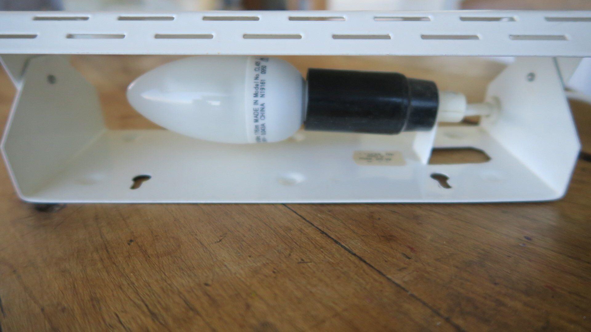 Wall lamp with red swivel shutter