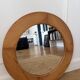 Round Scandinavian pine mirror from the 1970s.