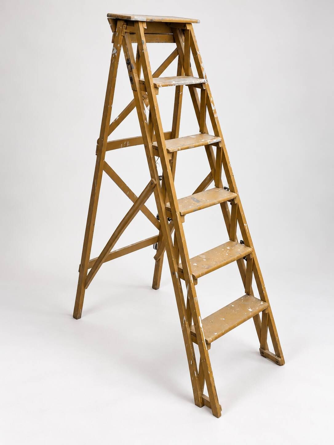 Vintage wooden painter's step ladder with a patina.