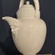 Large white faience jug with a satyr head spout, 19th century.