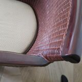 Vintage colonial-style armchair in woven rattan and exotic wood