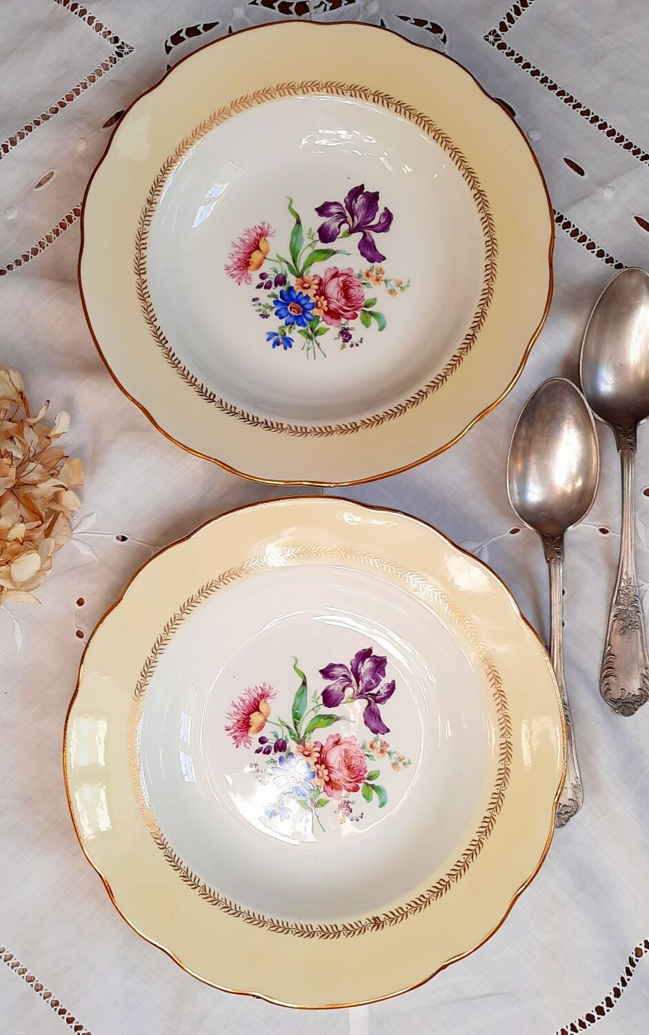 Old hollow plates mismatched in earthenware with gilded edges