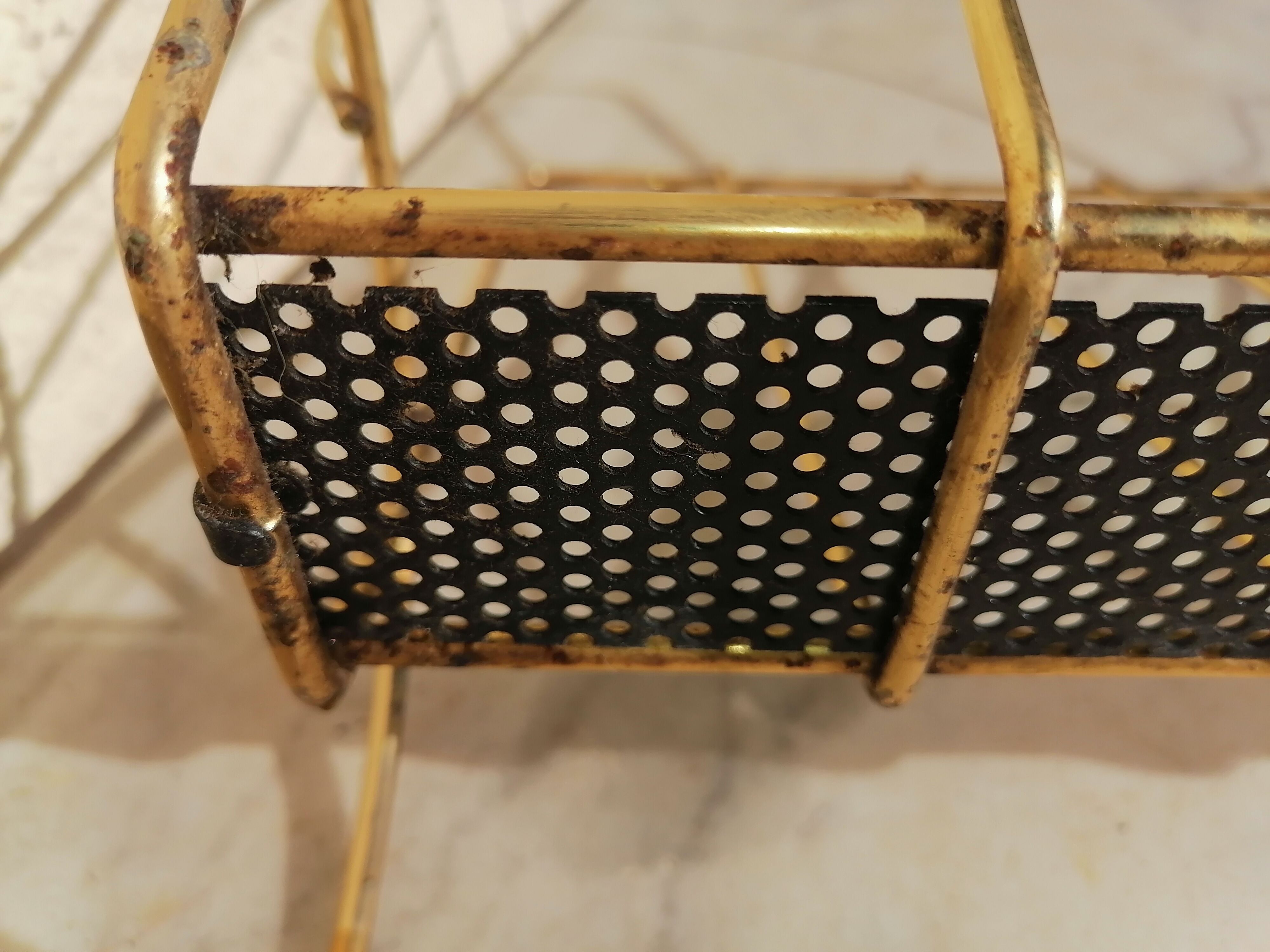 Vintage metal metal perforated magazine holder