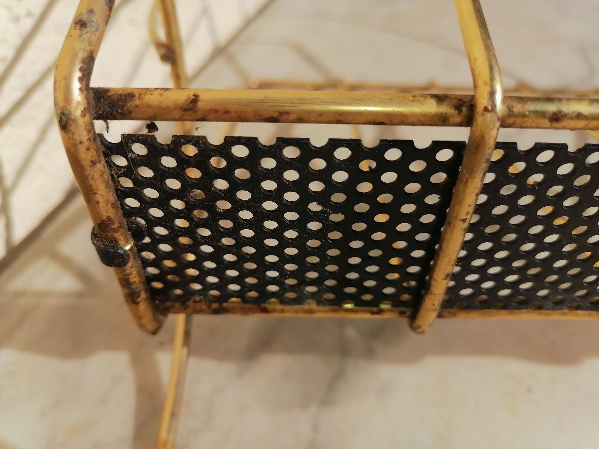 Vintage metal metal perforated magazine holder
