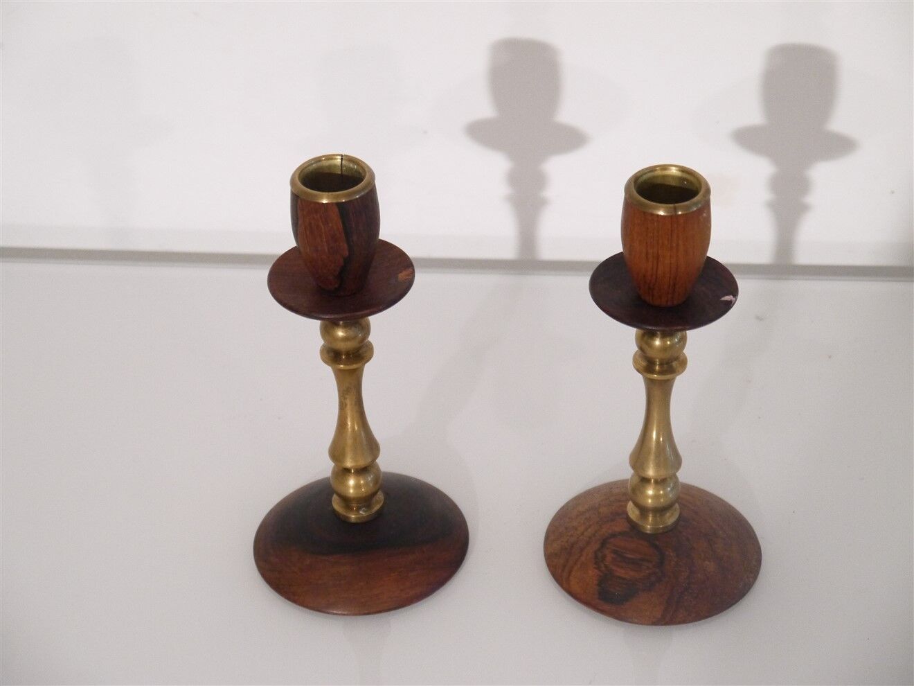 Pair of Scandinavian teak and brass candle holders