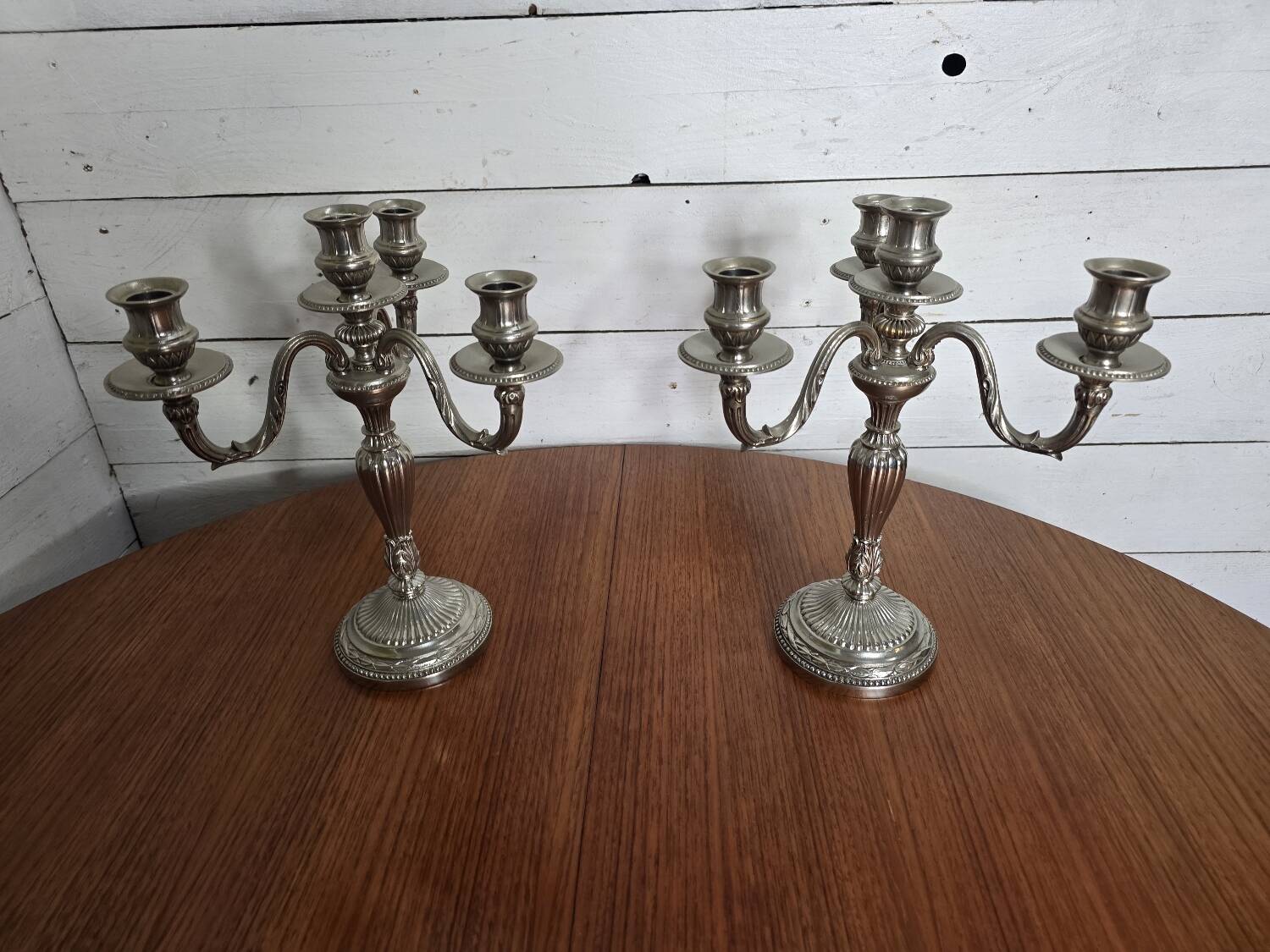 Pair of Louis XVI style candlesticks in silver-plated bronze